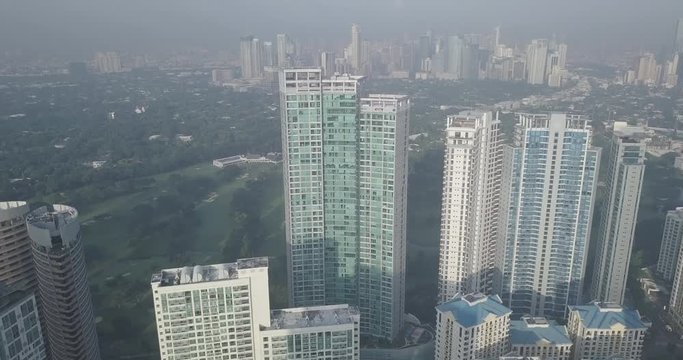 Ungraded, Aerial flight through business district revealing city capital's skyline. Drone, 4K.