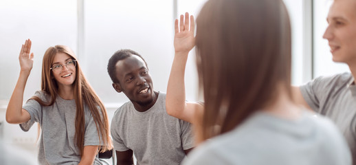 young people ask questions during the meeting