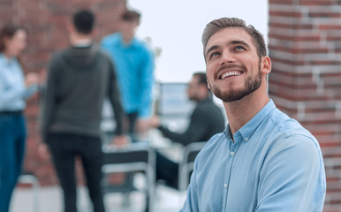 Cheerful man smiling in office.