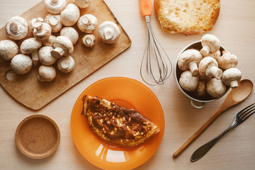 breakfast, homemade omelet and porcini mushrooms. cooking