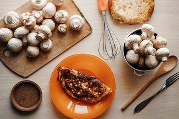 breakfast, homemade omelet and porcini mushrooms. cooking. dishes, top view