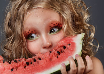close up portrait of cheerful beautiful little girl. cute girl eating watermelon