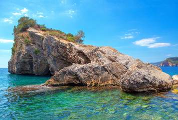 tropical scenery with rock formation in the sea water © Leilani