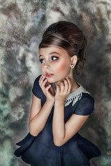 Fototapeta premium close up retro portrait of a beautiful girl with a pearl necklace and beautiful hair