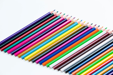 Craft Ideas. Closeup of Various Colorful Crayons Placed Closely in Row Together. Isolated Against White Background.