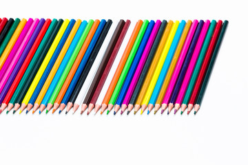 Obraz premium Craft Ideas. Closeup of Various Colorful Pencils Placed Together in Row. Isolated Against White.Picture made from Upper View.