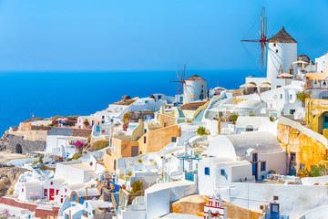 Greece Traveling. View of Greek Traditional Colorful Houses and Windmills of Oia or Ia at Santorini Island in Greece at Daytime.