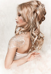 close up portrait of beautiful girl in ball dress with crown. professional winter makeup. little snow queen 