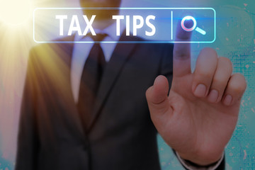 Word writing text Tax Tips. Business photo showcasing compulsory contribution to state revenue...