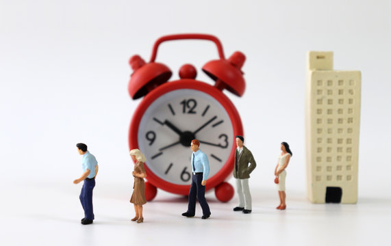 Miniature buildings and miniature people. The concept of increasing layoffs.
