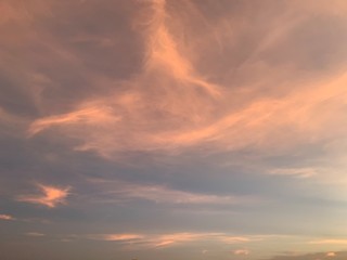 Obraz premium Background of colorful sky concept: Dramatic sunset with twilight color sky and clouds, Natural colors Evening sky Shine new day for Heaven,The light from heaven from the sky is a mystery.