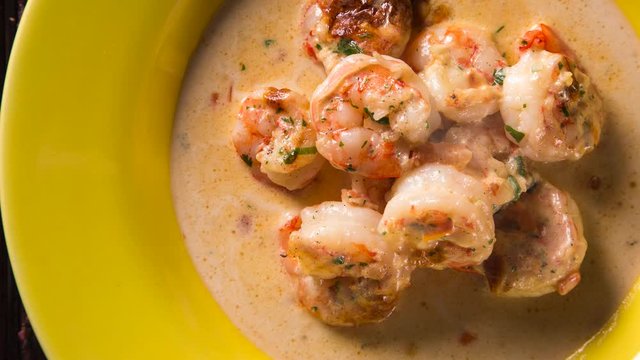 Shrimp gratin in cream cheese with smoke. Top view.