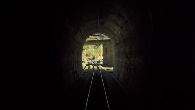 Railway scenery: Train going into tunnel 
