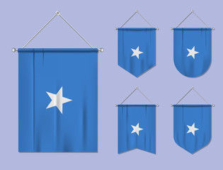 Set of hanging flags Somalia with textile texture. Diversity shapes of the national flag country. Vertical template pennant for banner, web, logo, award and festival
