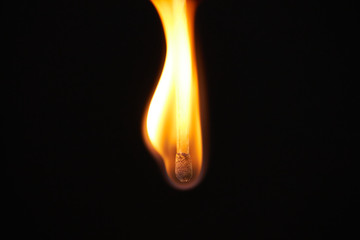 Close-up of a match being consumed by fire. Shut off by a puff. Smoke after being turned off.