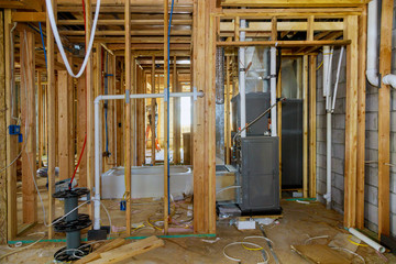 Fototapeta na wymiar Bathroom shower under plumbing connecting installation of heating system on the basement of the pipe system of heating closeup