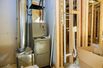 New home construction with installation of heating system in basement