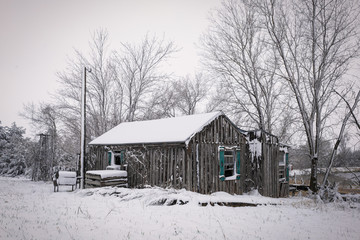 snow covered abandoned house