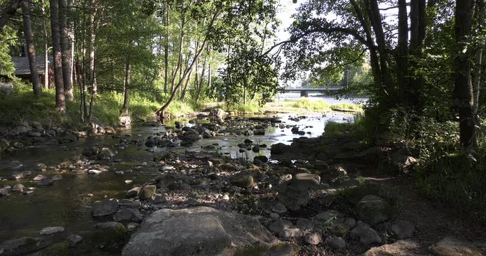 4K Kotka Langinkoski Imperial Fishing Lodge summer day high quality video, green woods, river and bridges in Finland, northern Europe