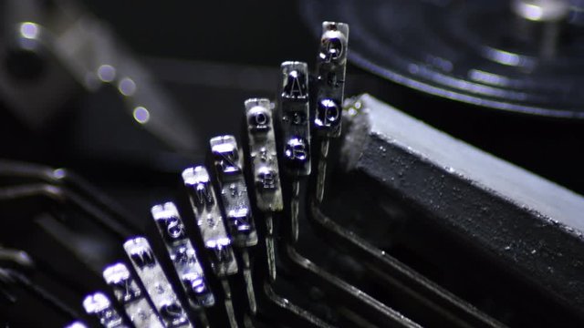 Typo keys of a qwerty typewriter writing