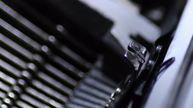 Typo keys of a manual qwerty old typewriter writing