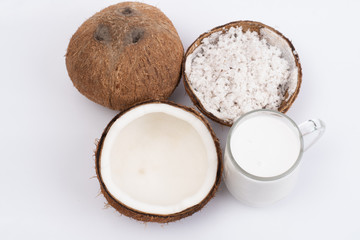 Coconut and a glass of coconut milk isolatd on white background. Healthy food.