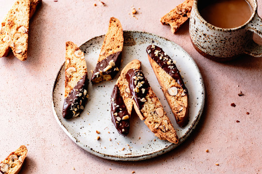 Closeup view of chocolate dipped hazelnut biscotti.