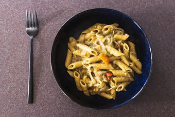 plant-based food, vegan one pot pesto pasta with onions and capsicums