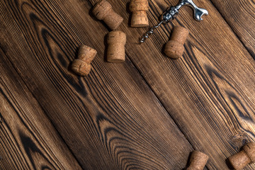 corks and corkscrew on an old wooden table
