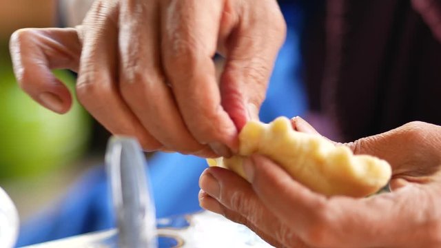 Making manadonese tuna stuffed bread/pastry (panada).  Indonesian version is traditionally filled with a combination of skipjack tuna, onions, coconut milk, chili peppers, and other ingredients.