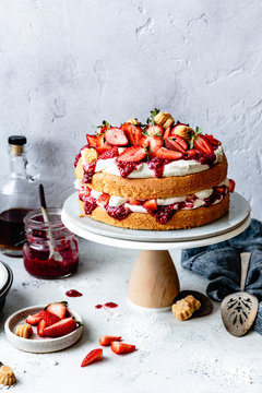 Strawberry sponge cake with maple candies on table