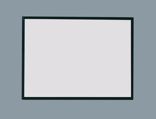 Empty black picture frame on grey background