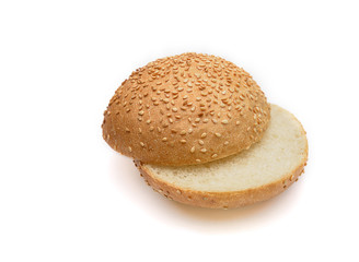 Fresh fragrant bun for burgers with sesame seeds on a white background. Can be used for advertising