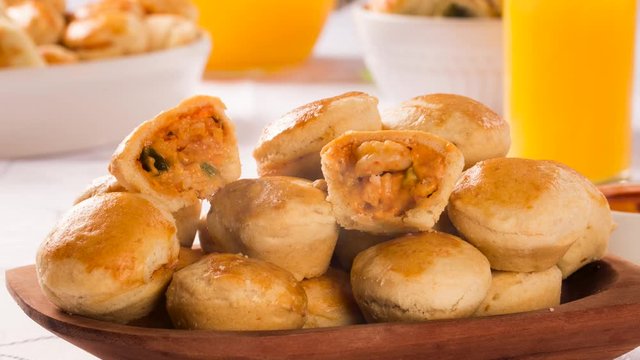 Empada Brazilian snack. pie with shrimp on white wood. Front view with smoke.