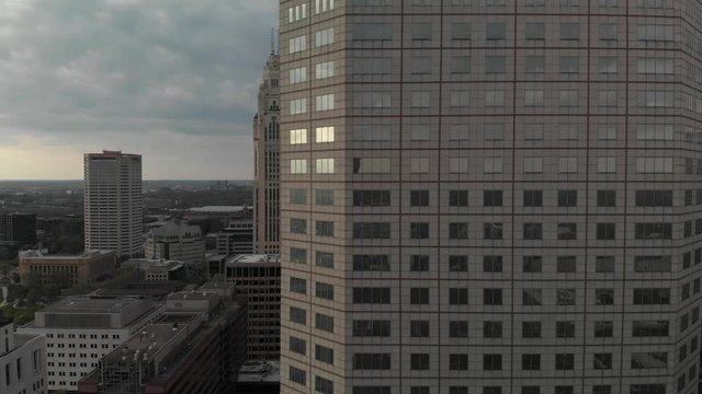 Cincinnati downtown city skyscraper buildings at sunset, aerial parallax reveal