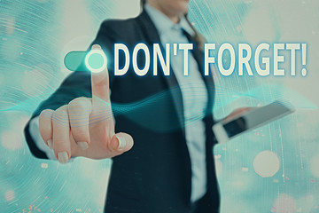 Conceptual hand writing showing Don T Forget. Concept meaning used to remind someone about an...