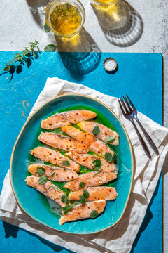 Latin American and Italian dish Crudo de Salmon. Raw Salmon marinated in lemon juice and spices. Top view