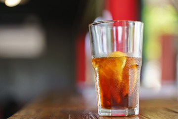 Iced cold brew coffee with slice of orange