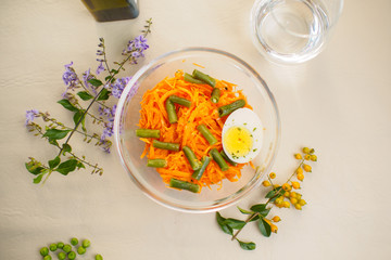 carrot salad and beans on a bould