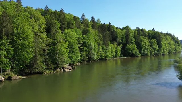 Forest around Isar river near the Alps seen from above. Bird view of River in south Germany. Aerial video