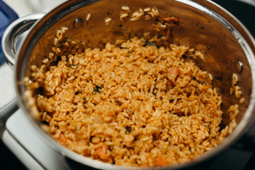 pilaf rice with greens dill large on in a pan

