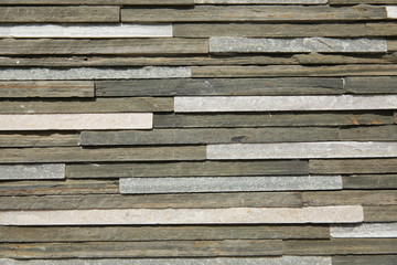 rough surface decorative tiles in gray and brown color. texture of stone. Pattern, texture, background 