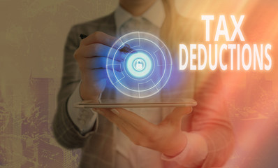 Word writing text Tax Deductions. Business photo showcasing an amount or cost that subtracted from...