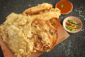 Gorengan, Indonesian traditional street food snacks, pisang goreng, bakwan and tempe, served with sambal or chili sauce and chilli pepper