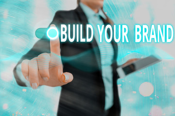 Conceptual hand writing showing Build Your Brand. Concept meaning enhancing brand equity using...