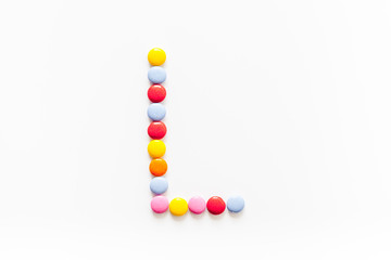 Candies font alphabet. Letter L isolated top view