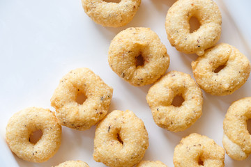 top view group of Thai Traditional Style Donut (Kanom Wong), homemade cooking deep fried in round circle shape tastes sweet crispy and salty. Thai dessert.