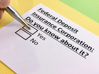 Obraz premium A person is answering question about federal deposit insurance corporation.