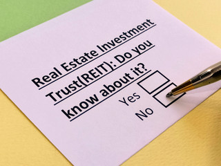 A person is answering question about real estate investment trust (REIT).