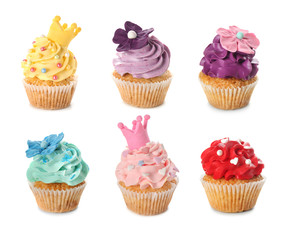 Delicious colorful cupcakes on white background